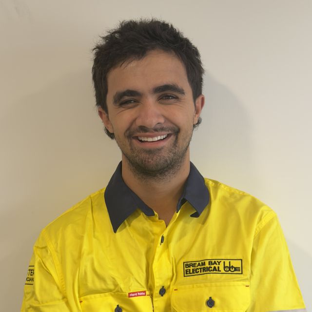 Trey Heiwari from Bream Bay Electrical in a yellow company work shirt